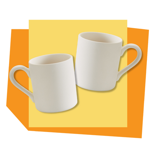 Two unpainted mugs on a yellow and orange background