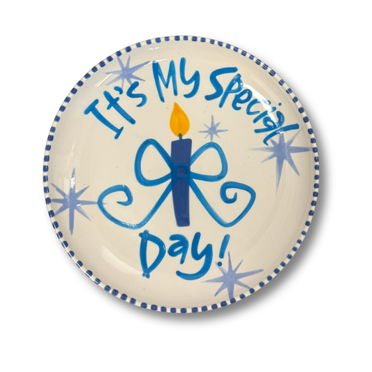 Decorative plate with a blue candle and star design, featuring the text 'It's My Special Day!' on a white background.