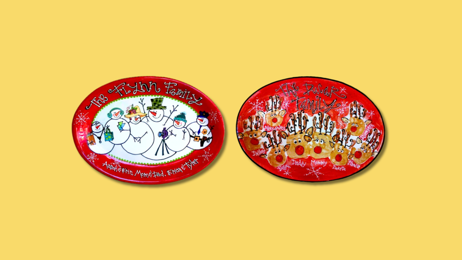 Two oval-shaped Christmas-themed plates with family and snowman designs on a yellow background.